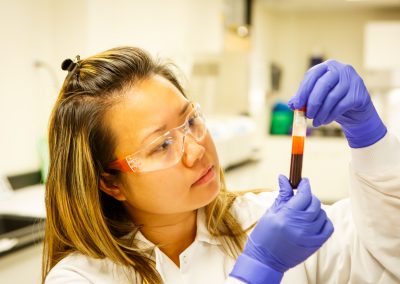 Blood vial with female lab tech