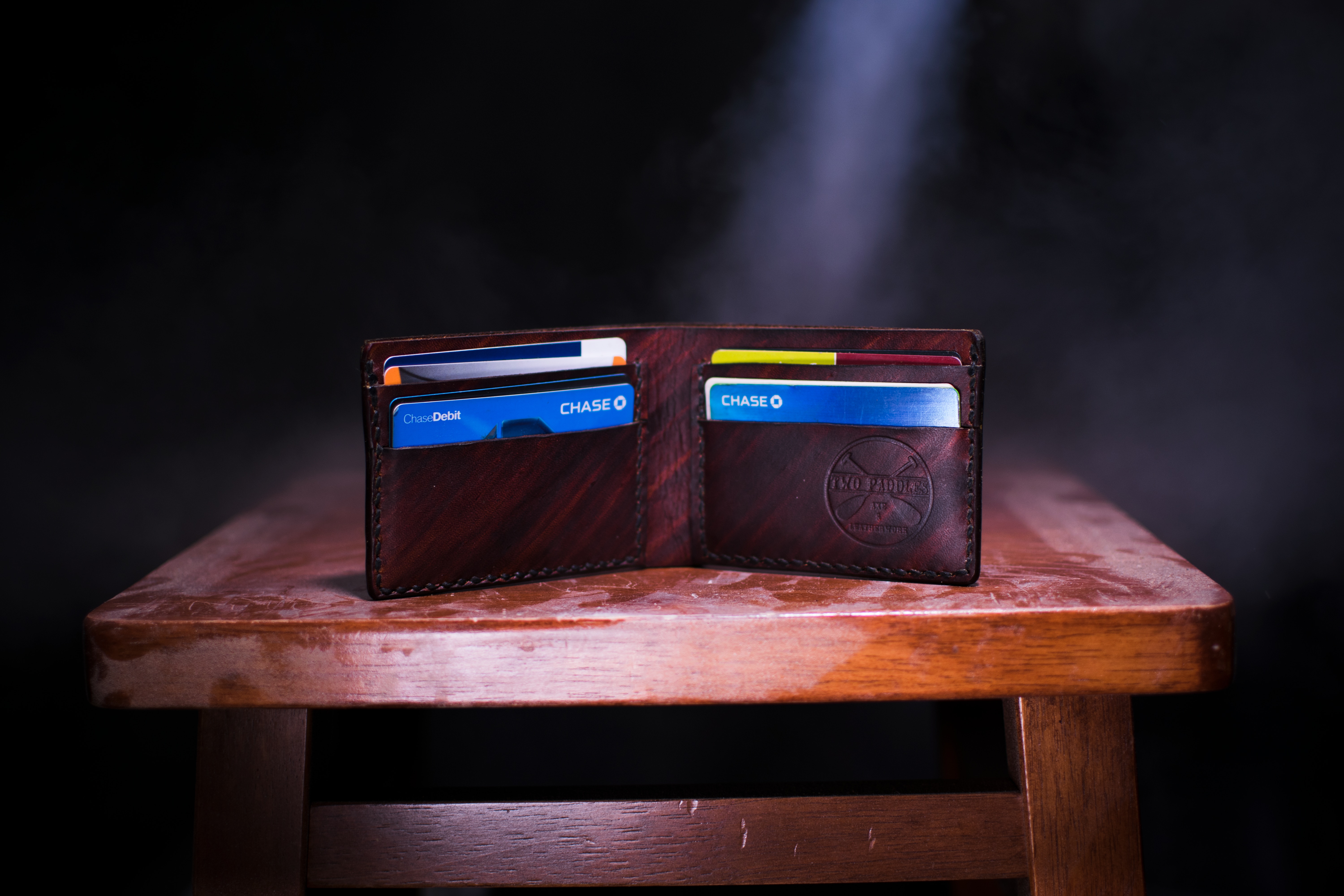Wallet fun of credit cards sitting on table. Credit card fraud. ECommerce.