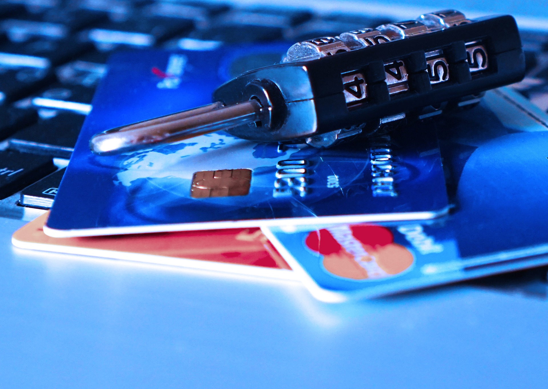 Credit cards stacked with a lock. ECommerce safety and credit card fraud prevention Credit cards stacked with a lock. ECommerce safety and credit card fraud prevention